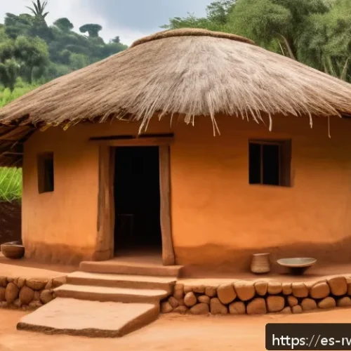 Home 33 르완다의 주요 건축 양식 - A traditional Rwandan rondavel house with circular shape and thatched roof, constructed from natural...